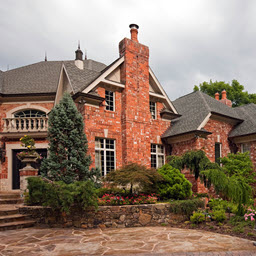 Brick house exterior with landscaping.